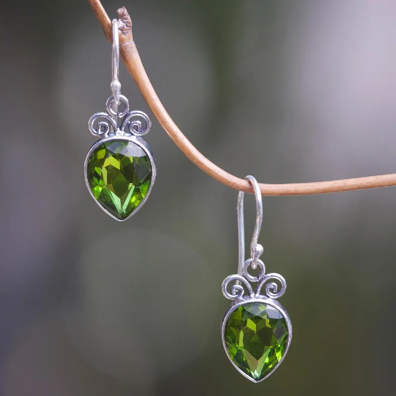 - Pet stroller can be taken on the planeFaceted Teardrop Artisan Crafted Balinese Silver and Peridot Dangle Earrings